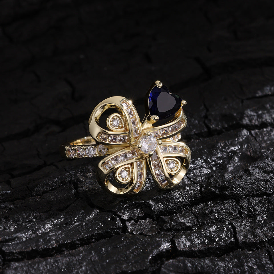 The new Baojiayong blooming flower bracelet plated with 18K gold floral blue diamond-set simple and sophisticated fashion women's set