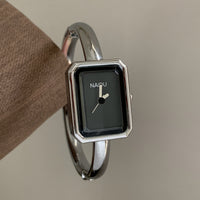 Silver band black face