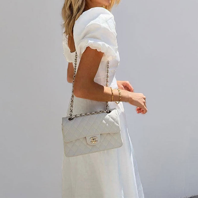 2026 spring cross-border European and beautiful clothing temperament slimming sexy hollow puff sleeves solid color large swing waist dress