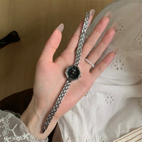 Silver band black face