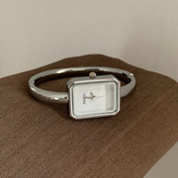 Silver belt with white face and white edge