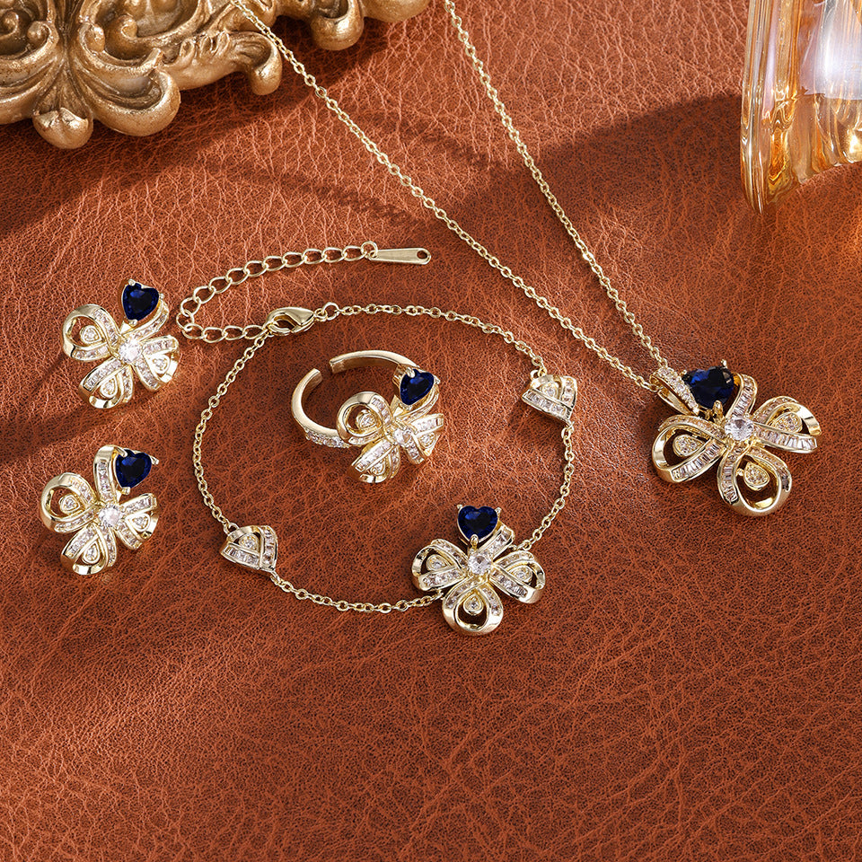 The new Baojiayong blooming flower bracelet plated with 18K gold floral blue diamond-set simple and sophisticated fashion women's set