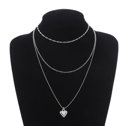 Cross-border jewelry level love pendant collar fashion women's twist chain peach heart clavicle chain source manufacturers