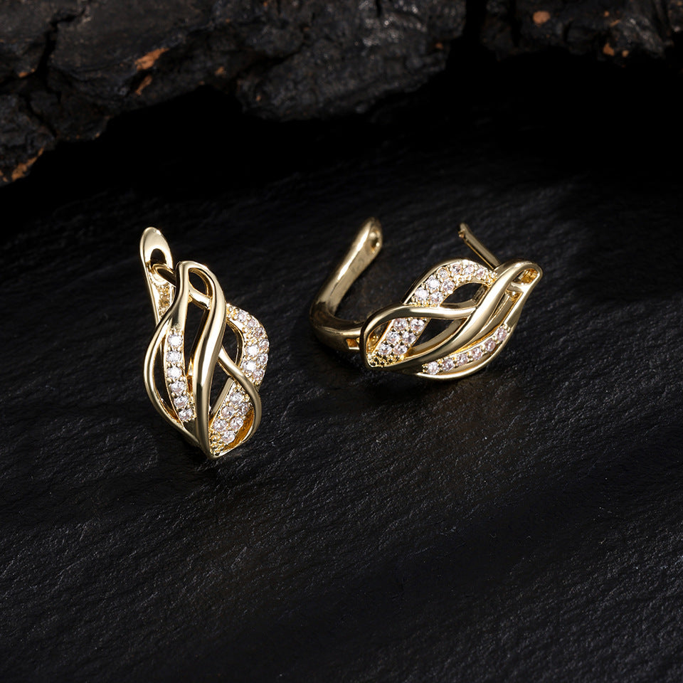 Light luxury women's niche twisted braided with irregular hollowed-out design accessories, metallic earrings, stud earrings