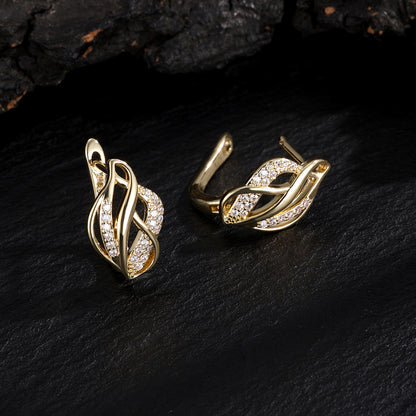 Light luxury women's niche twisted braided with irregular hollowed-out design accessories, metallic earrings, stud earrings
