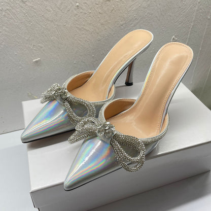 A kick of laser bow rhinestone high heel slippers, thin heels, pointed toe and half flip-flops, wearing a new European and American style
