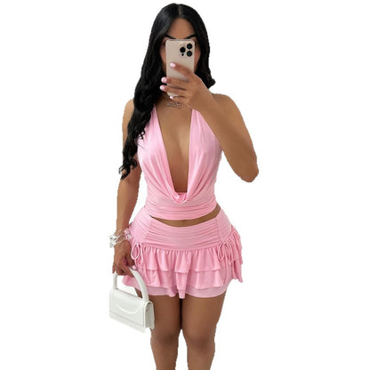 Cross-border new European and American women's clothing sexy hollow swing collar backless strappy top high-waisted cake short skirt two-piece set of women