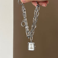 Silver belt white surface