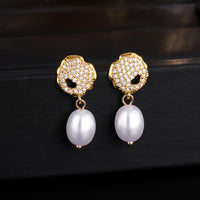 Golden pearl earrings