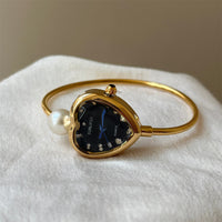 Gold band black face