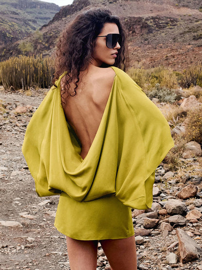 Foreign trade autumn and winter new European and beautiful clothing temperament solid color crew neck bat long sleeve open back short loose dress for women