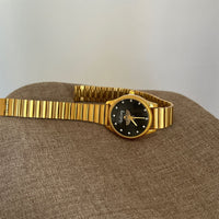 Gold band black face