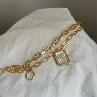 Gold belt white surface