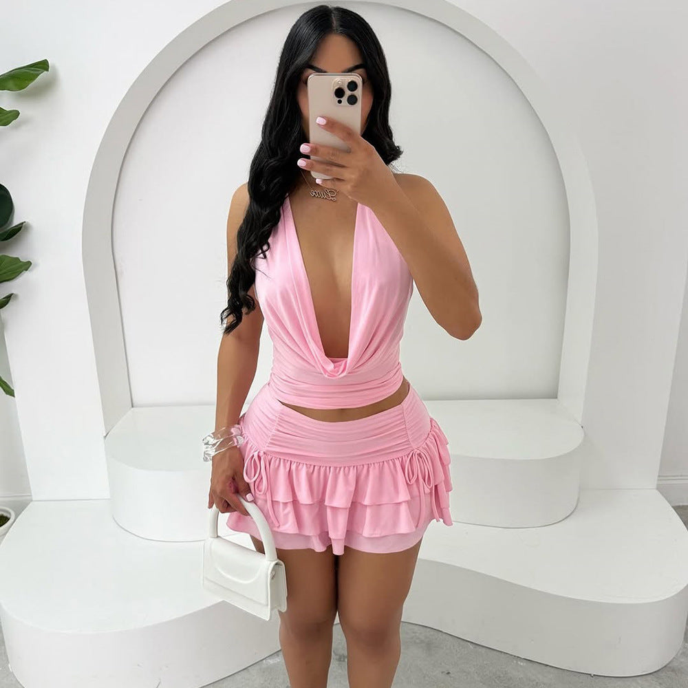 Cross-border new European and American women's clothing sexy hollow swing collar backless strappy top high-waisted cake short skirt two-piece set of women