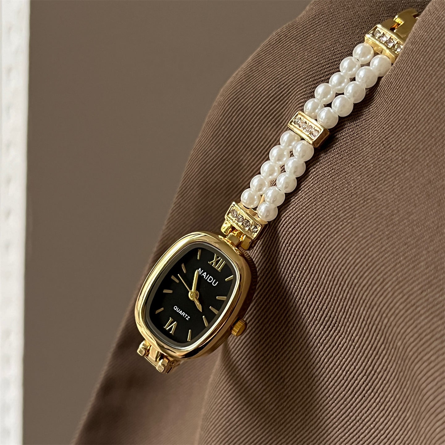 NAIDU new personalized pearl women's watch oval disc simple fashion watch small fragrance style women's Douyin live broadcast model