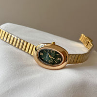 Gold belt green face