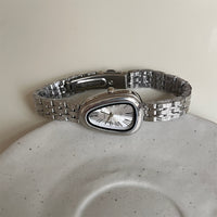 Silver belt white surface