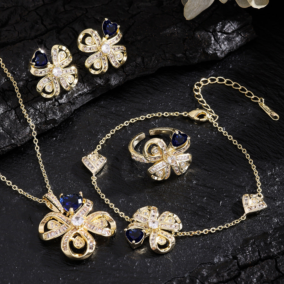 The new Baojiayong blooming flower bracelet plated with 18K gold floral blue diamond-set simple and sophisticated fashion women's set