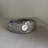 Silver belt white surface