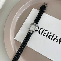 Black belt silver frame white noodles