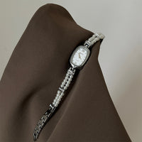 Silver belt white surface