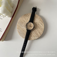 Black belt with an almond-shaped face