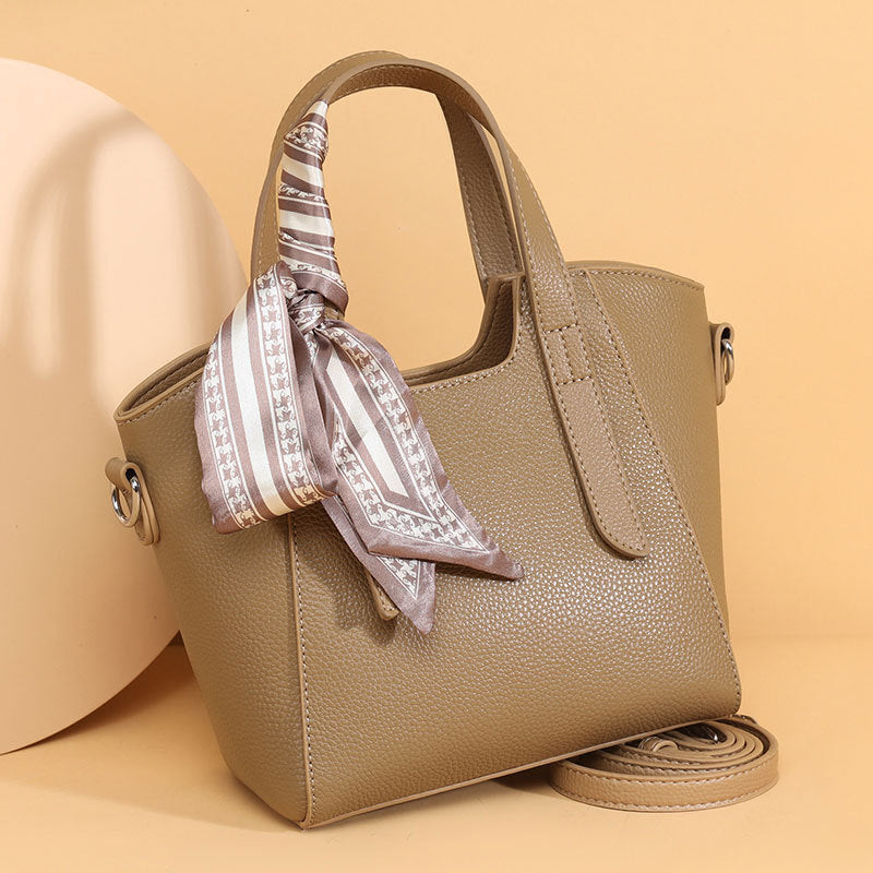 couro genuíno Bolsa de mão feminina Novo modelo fashion elegante Bolsa bucket elegante versátil para o dia a dia Bolsa de ombro feminina Internacional