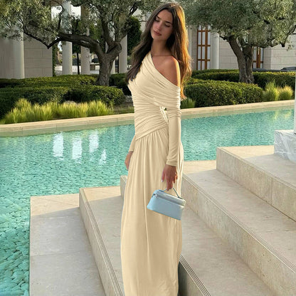 Cross-border wholesale European and American women's clothing autumn and winter new fashion solid color sexy diagonal collar pleated irregular long sleeve dress