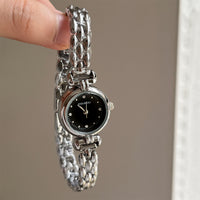 Silver band black face