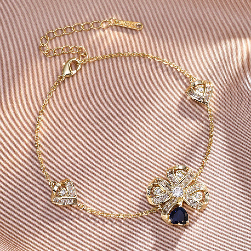 The new Baojiayong blooming flower bracelet plated with 18K gold floral blue diamond-set simple and sophisticated fashion women's set
