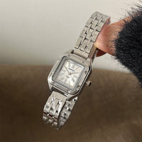 Silver belt white surface