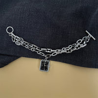Silver band black face