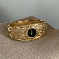 Gold band black face