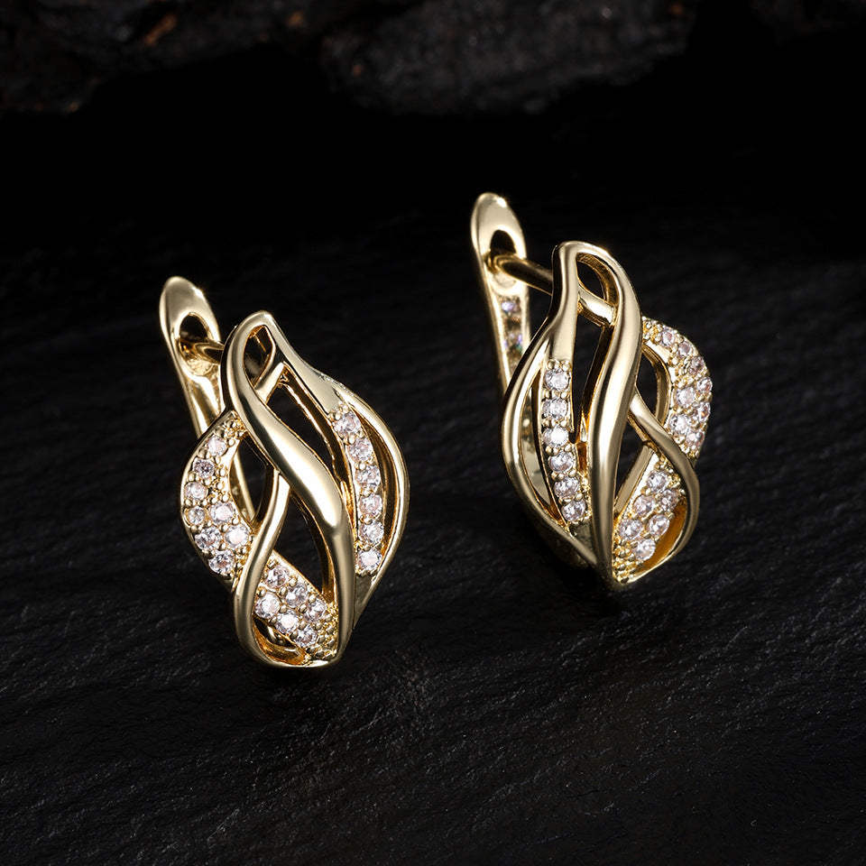 Light luxury women's niche twisted braided with irregular hollowed-out design accessories, metallic earrings, stud earrings