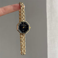 Gold band black face