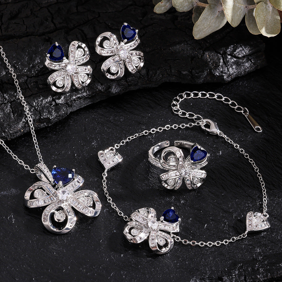 The new Baojiayong blooming flower bracelet plated with 18K gold floral blue diamond-set simple and sophisticated fashion women's set