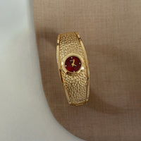 Gold with red face