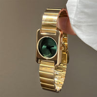 Gold belt green face